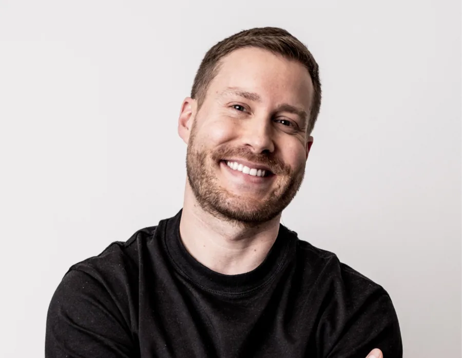 Sales representative smiling with arms folded
